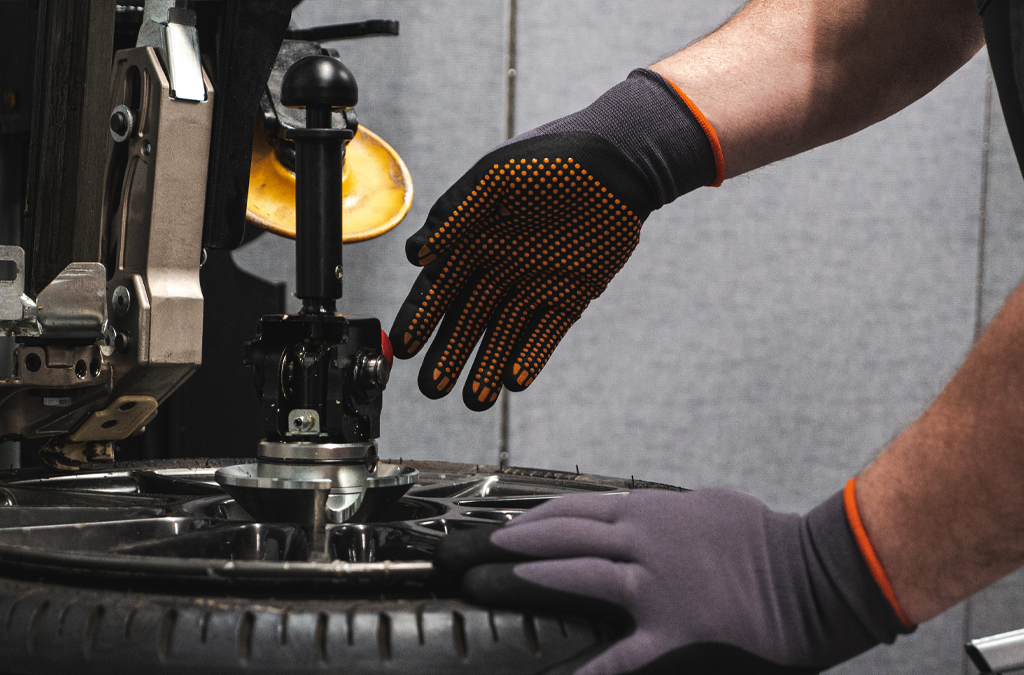 A pair of hands wearing reusable gloves